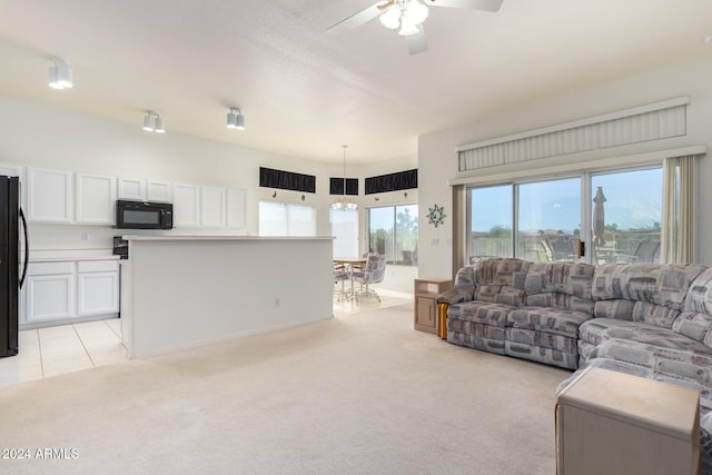 11553 W Sonoran Ct, Surprise, AZ 85378 - living room with ceiling fan and light colored carpet