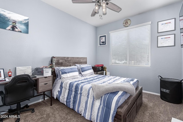 bedroom featuring dark carpet and ceiling fan