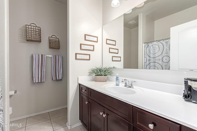 bathroom with tile patterned flooring and vanity