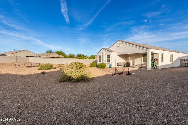 rear view of house featuring a patio