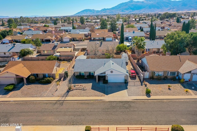 birds eye view of property with a mountain view