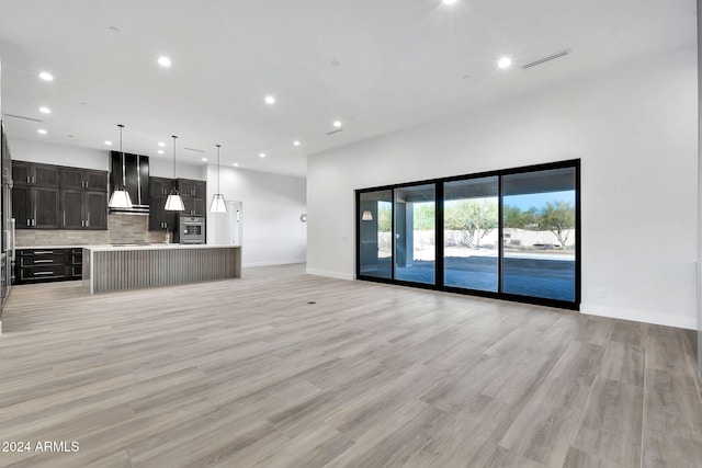 unfurnished living room with light hardwood / wood-style floors