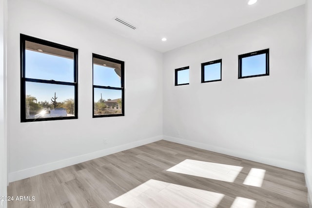 spare room featuring light wood-type flooring