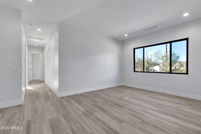 spare room with light hardwood / wood-style floors