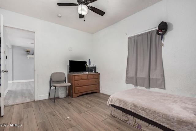 3913 W Sherman St, Phoenix, AZ 85009 - bedroom with wood finished floors, baseboards, and ceiling fan