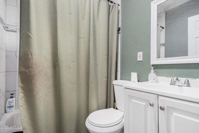 3913 W Sherman St, Phoenix, AZ 85009 - bathroom with a textured wall, toilet, vanity, and a shower with curtain