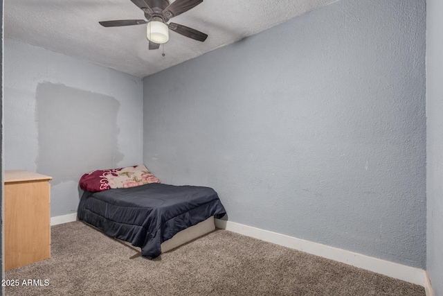 3913 W Sherman St, Phoenix, AZ 85009 - carpeted bedroom featuring baseboards, a textured ceiling, and a ceiling fan