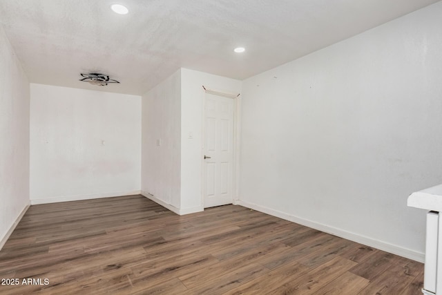3913 W Sherman St, Phoenix, AZ 85009 - empty room with wood finished floors, baseboards, and recessed lighting