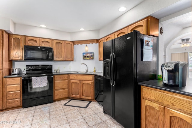 kitchen with sink, black appliances, ceiling fan, and light tile patterned flooring