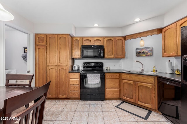 kitchen with light tile patterned flooring, sink, and black appliances