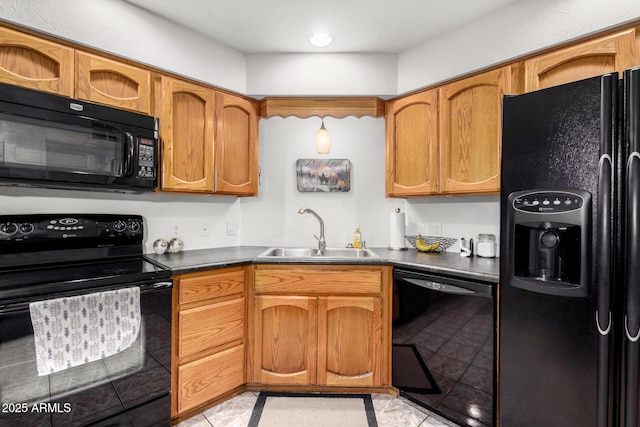 kitchen featuring light tile patterned floors, sink, and black appliances