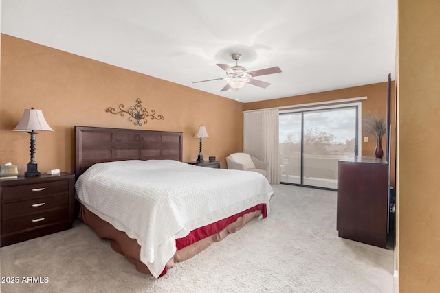 carpeted bedroom with ceiling fan and access to exterior