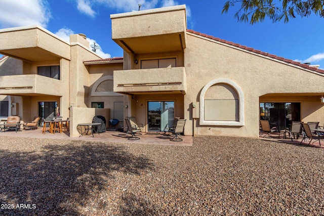 rear view of house with a patio