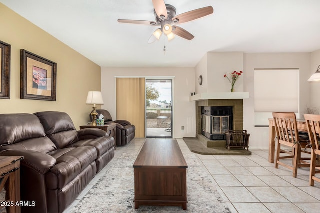 tiled living room featuring ceiling fan