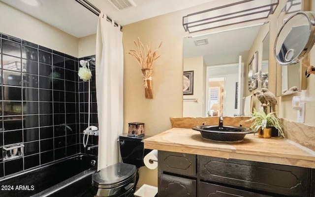 full bathroom with vanity, toilet, and shower / tub combo with curtain