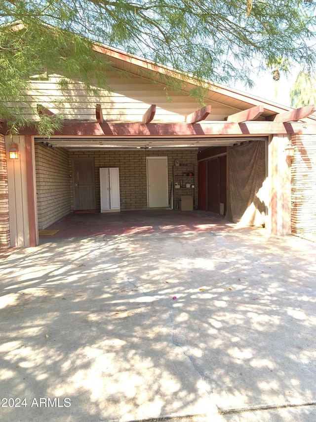 garage featuring a carport