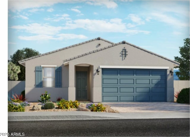 view of front of home featuring driveway, a tiled roof, an attached garage, and stucco siding