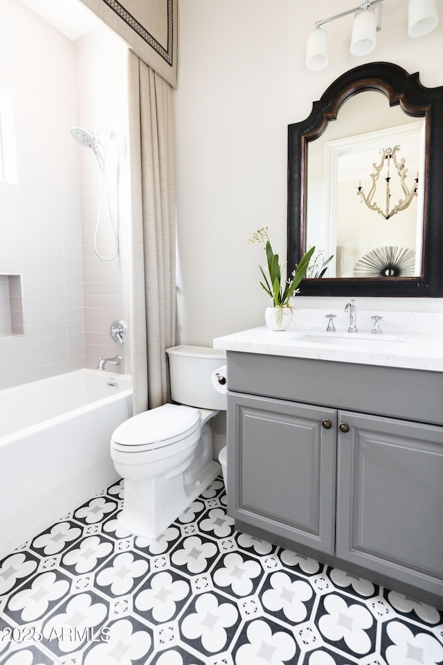 bathroom with tile patterned flooring, toilet, vanity, and shower / bath combo