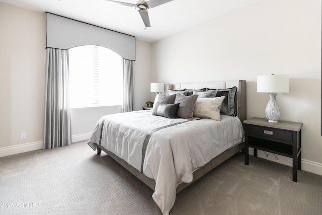 carpeted bedroom with ceiling fan and baseboards