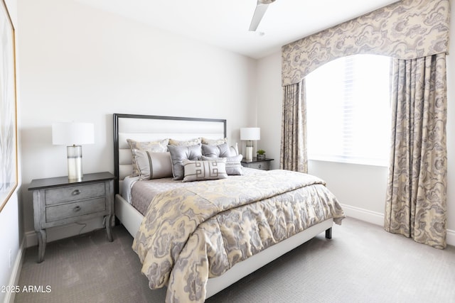 bedroom featuring baseboards, carpet, and ceiling fan