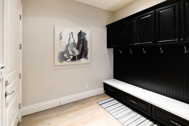 mudroom with baseboards and light wood finished floors