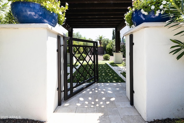 view of gate with fence