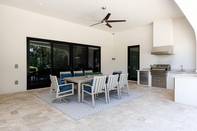 view of patio / terrace with a sink, area for grilling, outdoor dining space, and ceiling fan