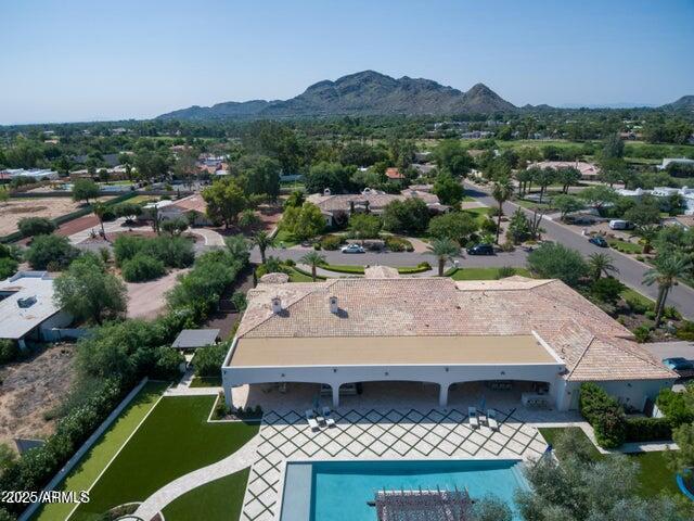 birds eye view of property with a mountain view