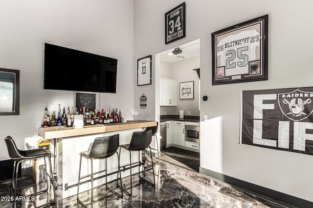 18139 W Oregon Ct, Litchfield Park, AZ 85340 - indoor dry bar featuring stainless steel microwave