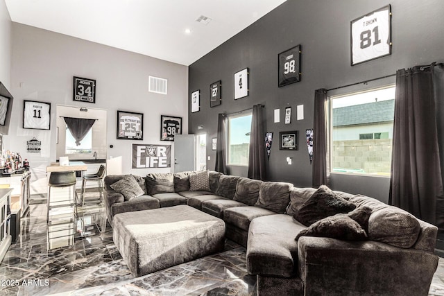 18139 W Oregon Ct, Litchfield Park, AZ 85340 - living room with a high ceiling, marble tiled floors, plenty of natural light, and recessed lighting