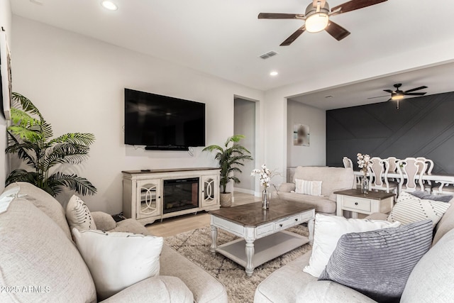 18139 W Oregon Ct, Litchfield Park, AZ 85340 - living area with ceiling fan, recessed lighting, wood finished floors, and baseboards