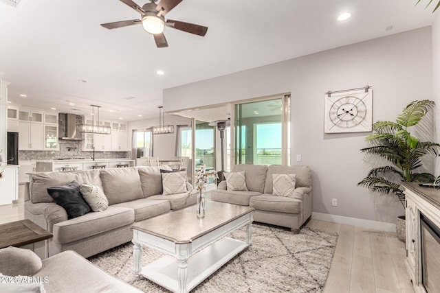 18139 W Oregon Ct, Litchfield Park, AZ 85340 - living room featuring recessed lighting, light wood finished floors, a ceiling fan, and baseboards