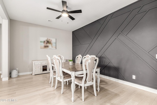 18139 W Oregon Ct, Litchfield Park, AZ 85340 - dining area featuring light wood-style floors, ceiling fan, and baseboards