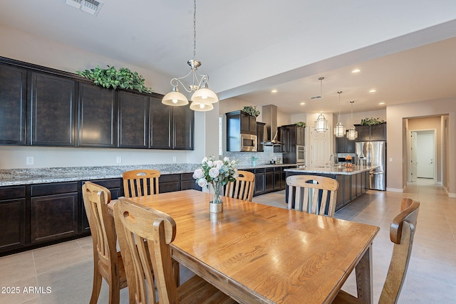 tiled dining area with sink