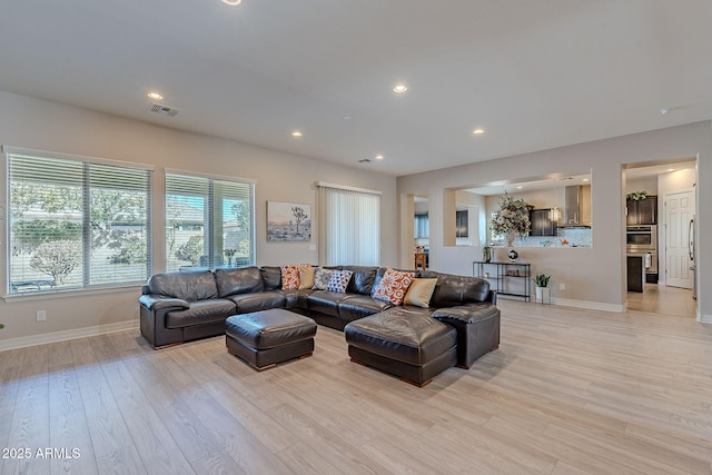 living room with light hardwood / wood-style flooring