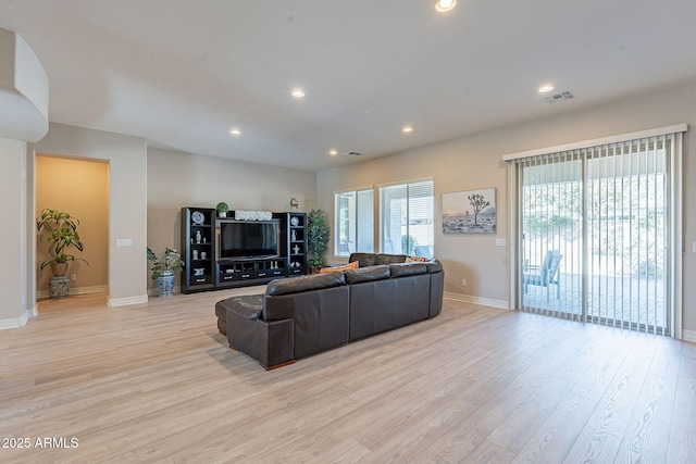 living room with light hardwood / wood-style floors