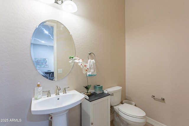 bathroom with sink and toilet