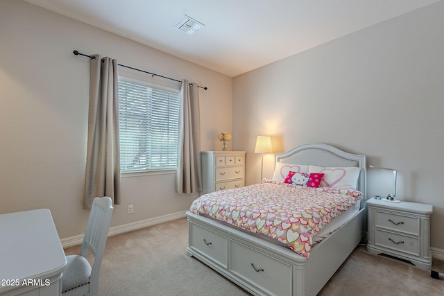 bedroom featuring light carpet