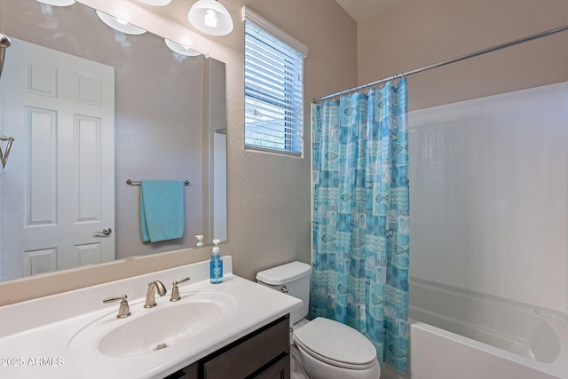 full bathroom featuring shower / bath combo, vanity, and toilet