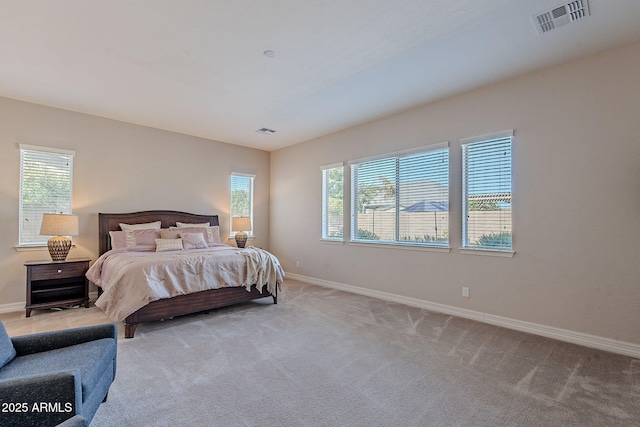 bedroom featuring light colored carpet