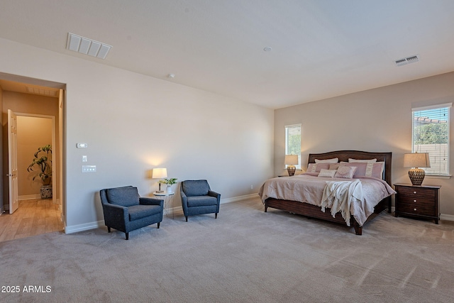 carpeted bedroom with multiple windows