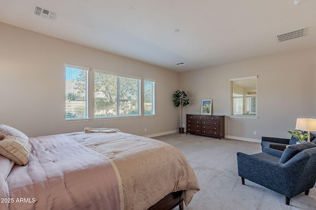 carpeted bedroom featuring multiple windows