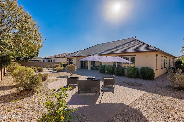 back of house featuring a patio