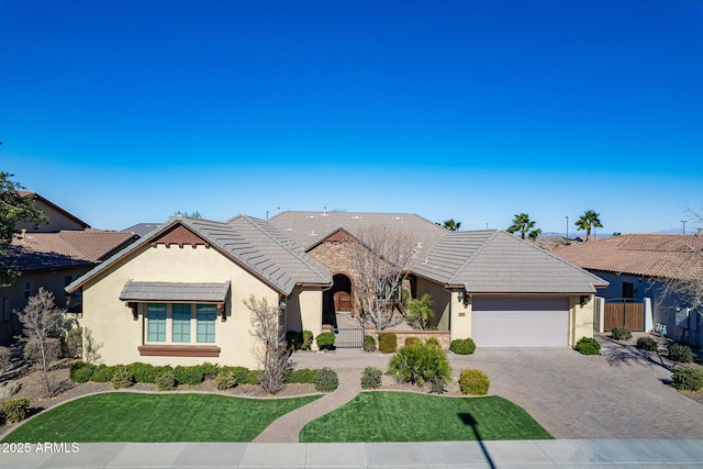 view of front of home with a garage and a front yard