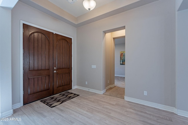 foyer entrance featuring light wood-type flooring