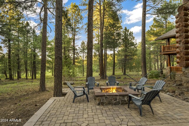 view of patio / terrace featuring a fire pit