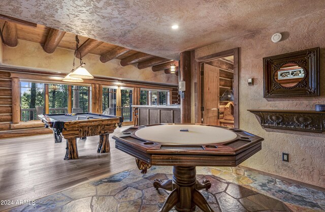 game room featuring hardwood / wood-style flooring, a textured ceiling, billiards, and beam ceiling