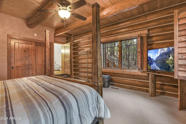 bedroom featuring wooden ceiling, beamed ceiling, log walls, and carpet floors