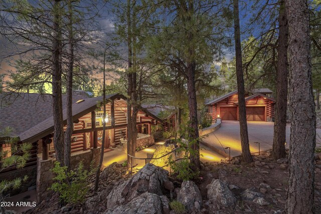 exterior space with an outbuilding and a garage