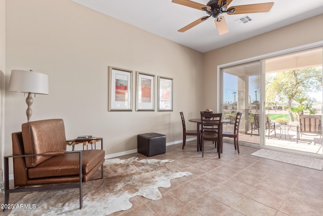 sitting room with a ceiling fan, light tile patterned flooring, visible vents, and baseboards